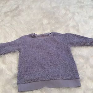 Blue and purple sweaters